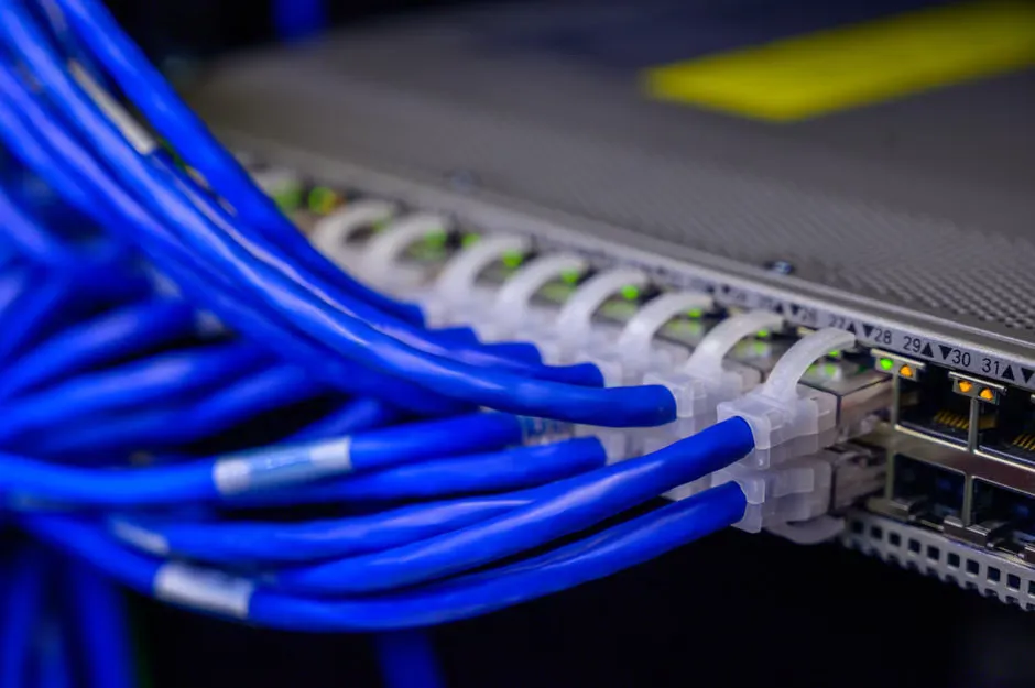 Network switch and patch cabling inside a hospital communications cabinet