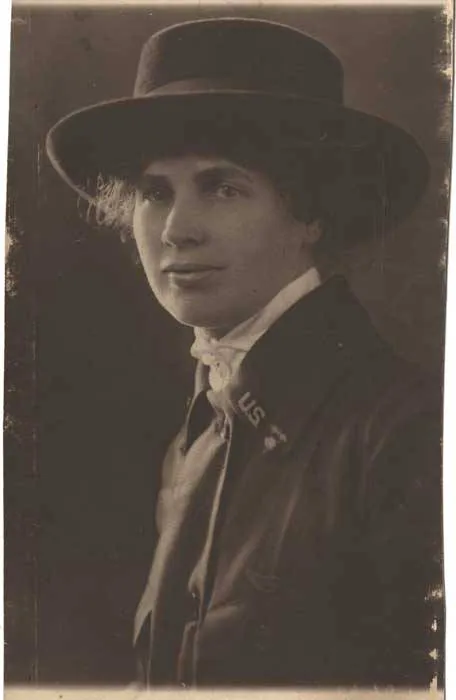 Nurse entering a single hospital patient room with a staff identification badge clipped to her uniform